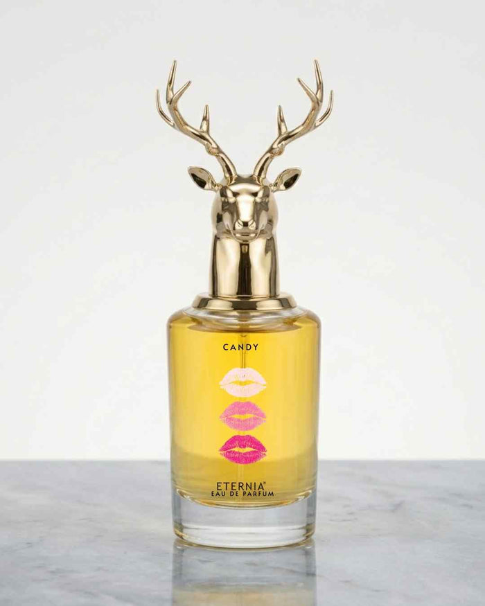 Eternia Candy Eau de Parfum bottle with deer-head gold cap and amber liquid
