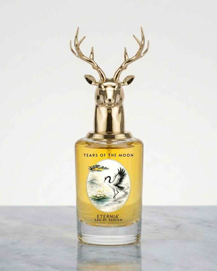 Eternia Tears of the Moon eau de parfum bottle with gold deer antler cap and amber