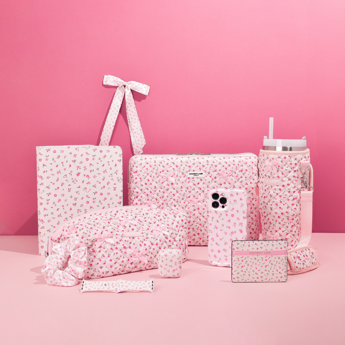 Pink floral card holder and matching accessories on a pink background.
