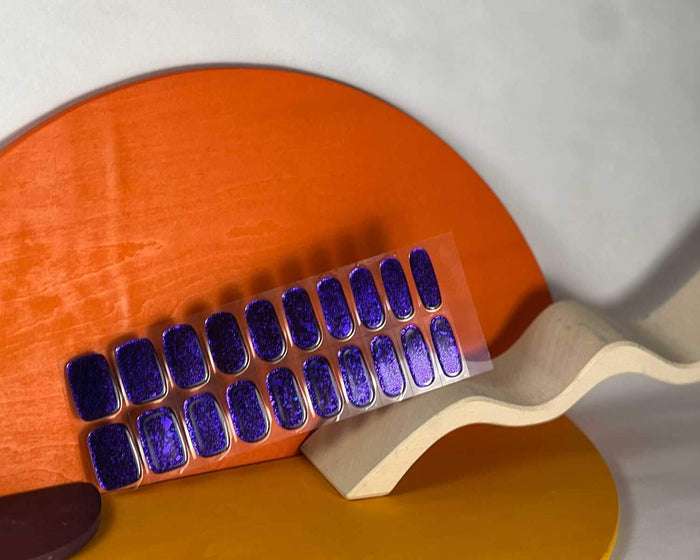 Violet Luster semi-cured gel nail wraps on a nail mock-up, alternate angle