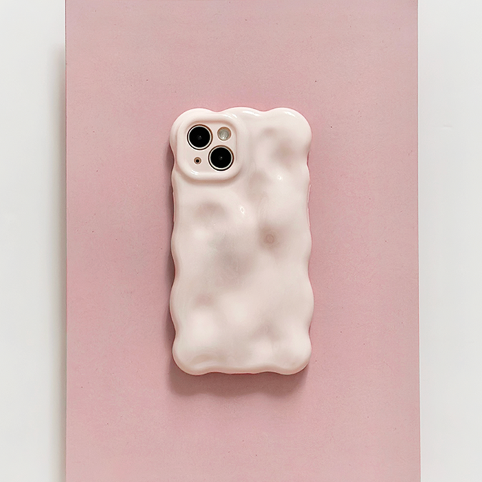 Powder pink 3D bubble phone case by Coconut Lane on a wavy pink background.