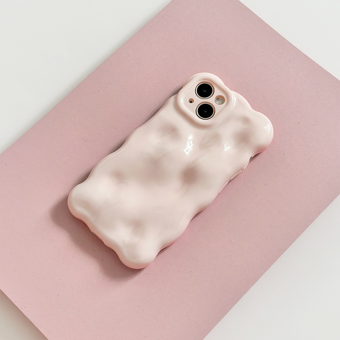 Powder pink 3D bubble phone case by Coconut Lane on a light pink rectangular surface.