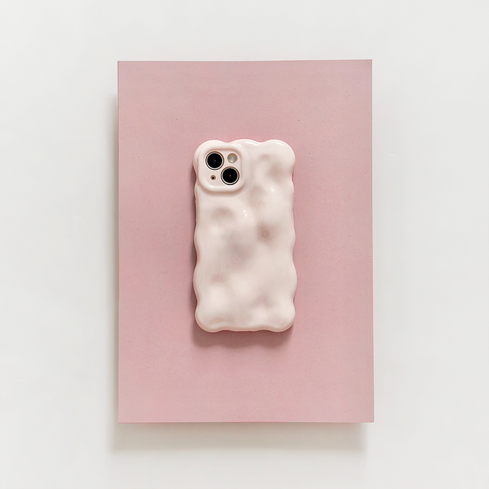 Powder pink 3D bubble phone case from Coconut Lane displayed on a pink rectangle against a white background.