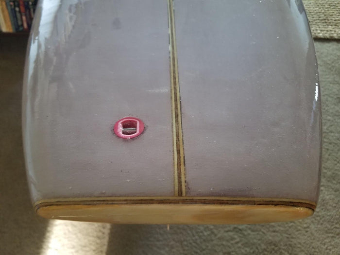 Surfboard made using six ounce fiberglass fabric and resin.