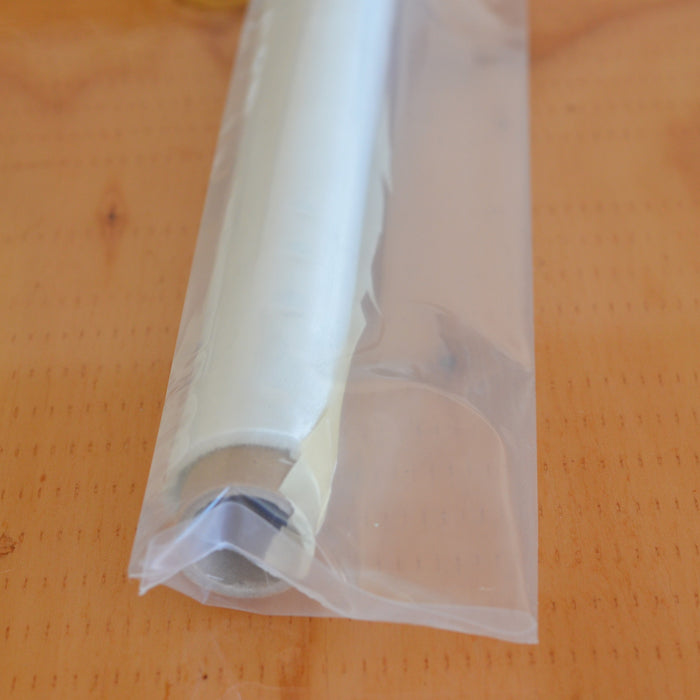.75 ounce fiberglass cloth rolled on cardboard core and sealed in plastic.