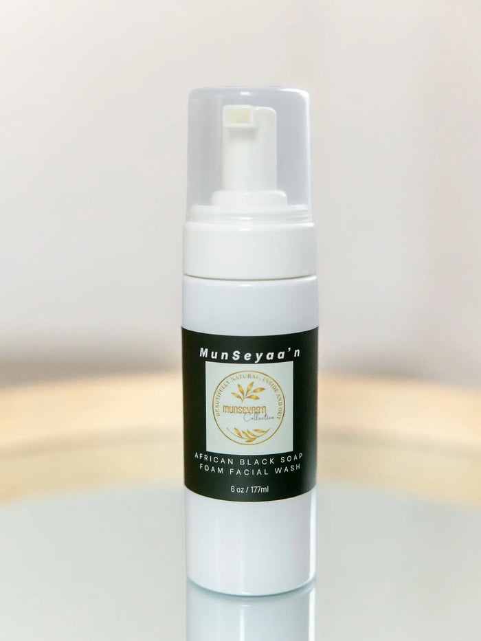 Bottle of African Black Soap foam cleanser with natural ingredients for face, body, and hair cleansing