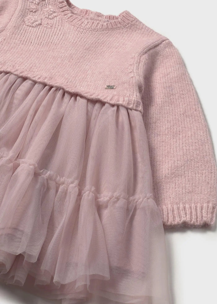 Close-up of knit bodice with appliqué details