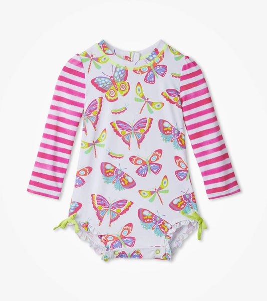 Hatley baby girl Botanical Butterflies rashguard swimsuit with pink striped sleeves and ruffle legs