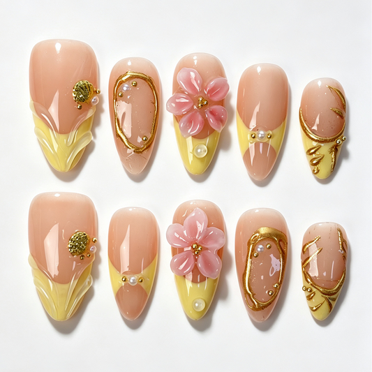 Butter‑Blossom almond press‑on nails, butter yellow tip, pink 3D blossom flower, gold foil lines and pearl decor fake nails