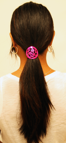 Pink Celtic circle hair hook securing ponytail, rear view
