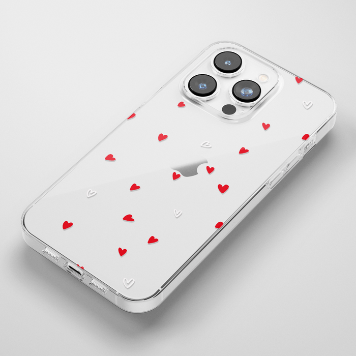 Clear iPhone 15 case with a red and white heart pattern, showcasing a slim and stylish design.