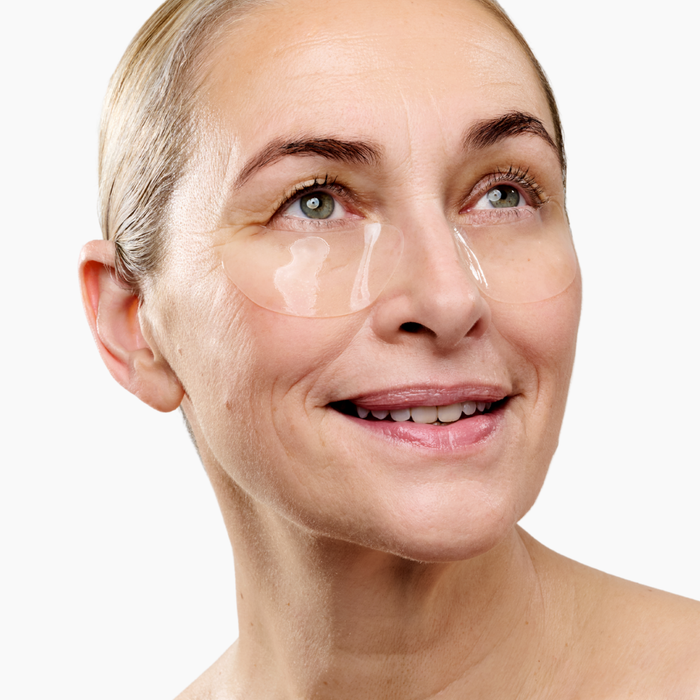 Woman wearing hydrogel eye patches