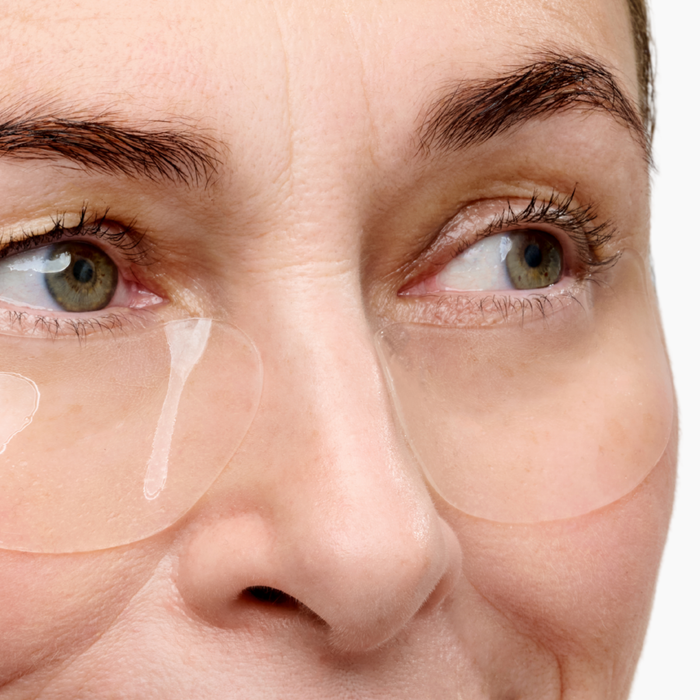 Woman wearing hydrogel eye patches