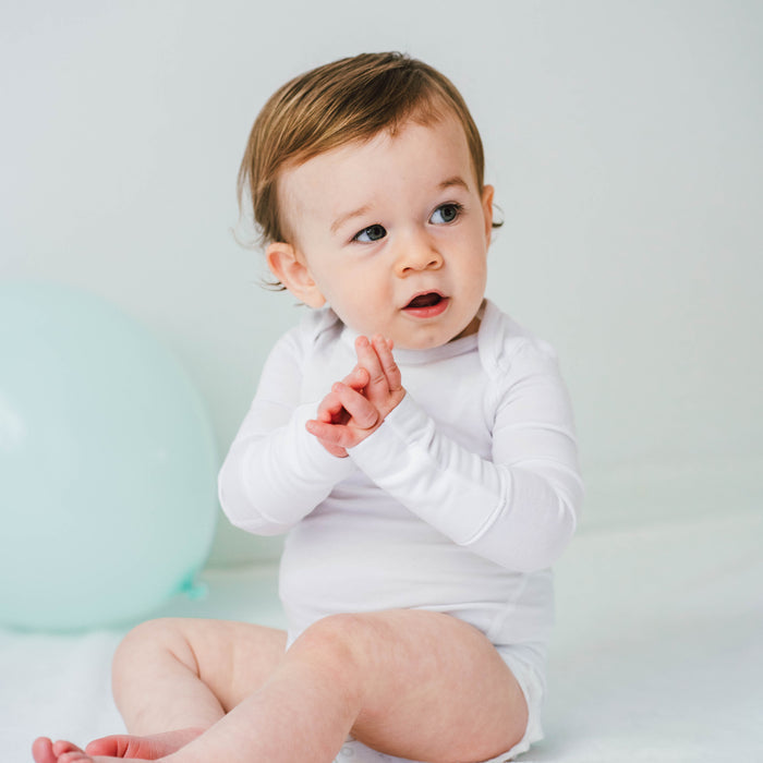 Baby wearing a Dreamskin eczema bodysuit