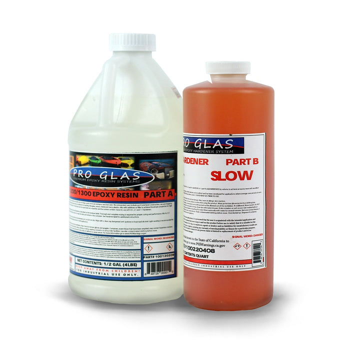 Three quarter gallon of 2:1 epoxy resin kit. Clear .5 gallon of epoxy Part A and quart of orange tinted slow Part B hardener.