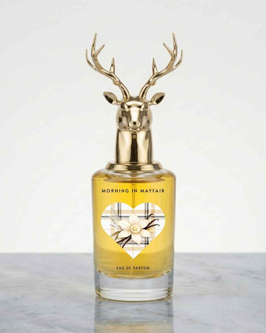 Gold deer-antler eau de parfum bottle with amber glass and floral label