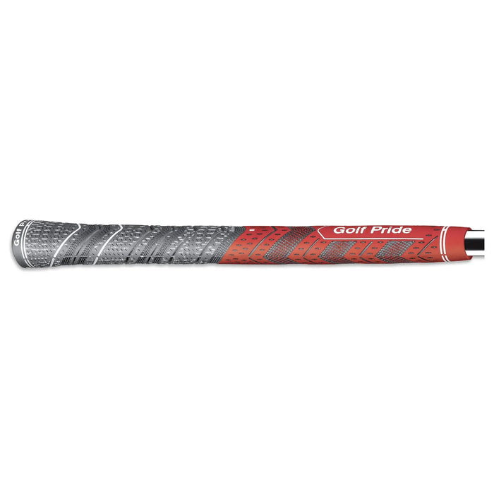 A golf grip in red and gray is lying horizontally with textured patterns for enhanced grip. The branding "Golf Pride" is visible, indicating its intended use for golfing.