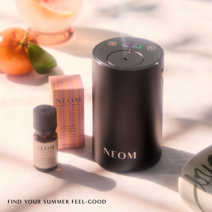 "NEOM great day essential oil blend and black pod mini"
