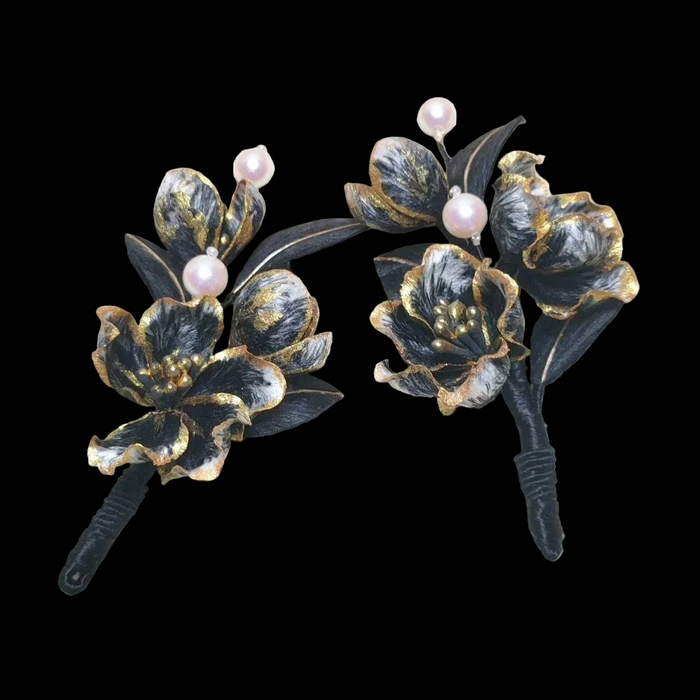 Handcrafted black Ronghua hair accessory with gold-edged silk petals and pearl accents on a flexible base.