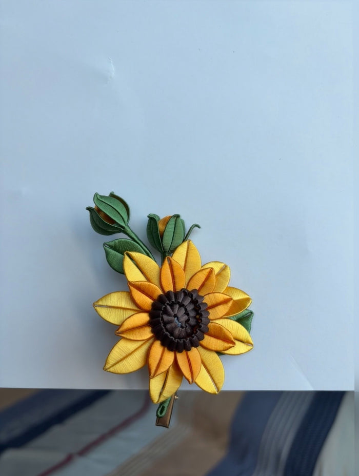 Handmade Chanhua sunflower hair clip on a white surface-3