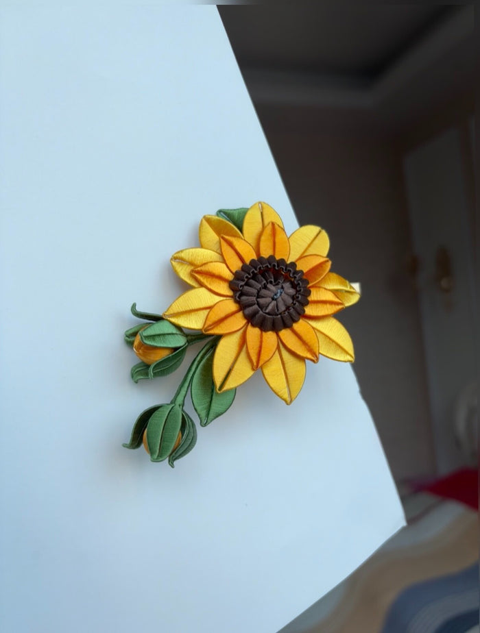 Handmade Chanhua sunflower hair clip on a white surface-4