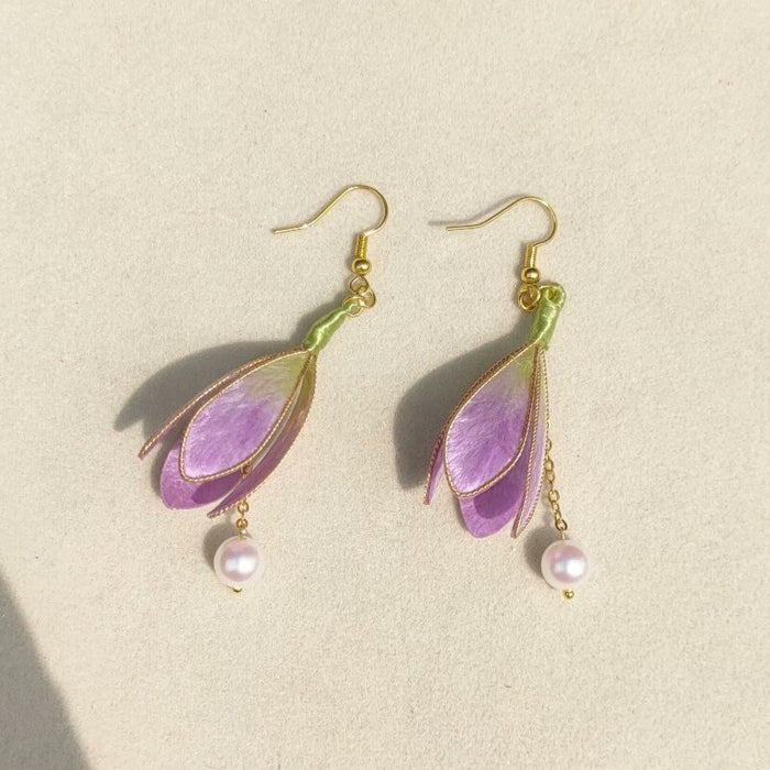 3D silk velvet flower earrings depicting blooming magnolias made with traditional artisanal Ronghua techniques.