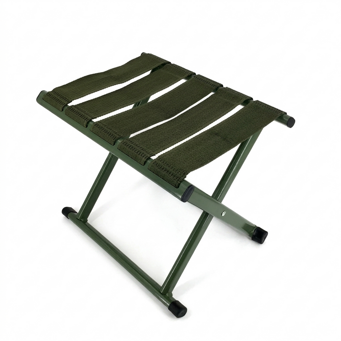 Green folding stool on a white background
