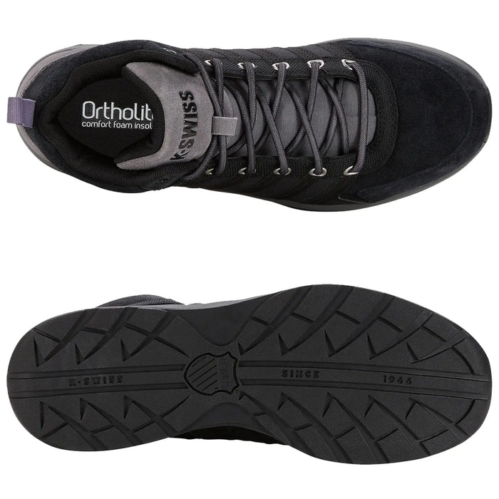 Black athletic shoe with a textured rubber sole and reflective laces sits flat showing the top and bottom views. The insole features Ortholite comfort foam and the outsole displays K-Swiss branding.