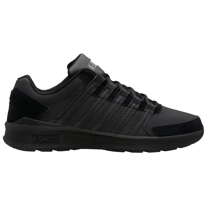 Black athletic shoe features a sleek design with multiple stripes and a cushioned sole positioned on a white background showcasing durability and style in footwear.
