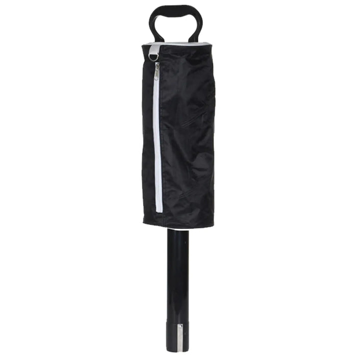 A black umbrella is standing upright with a cylindrical handle and a zipped cover. The cover is partially zipped, revealing the umbrella's structure in a neutral background.