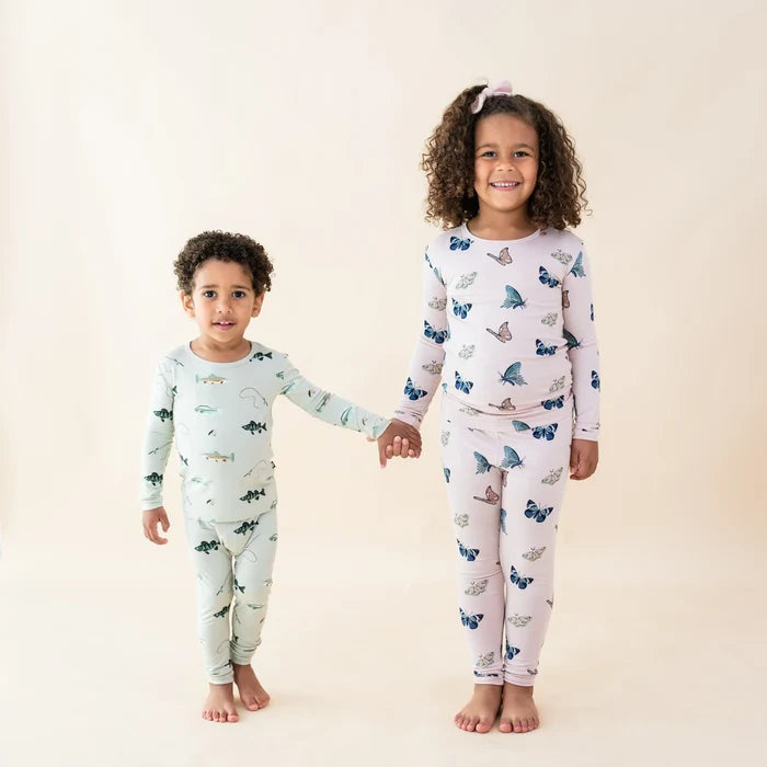 Kids wearing Kyte Baby bamboo pajamas, including Blush Butterfly girls pajama set and matching sleepwear styles.