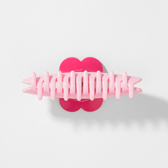 Pink hair clip with heart design on a white background