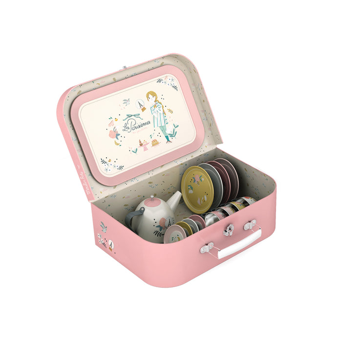Pink toy tea set with a teapot and cups in a decorative case on a white background