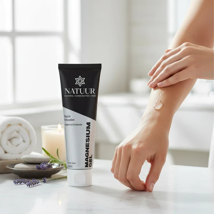 Natuur.in Magnesium Muscle Relaxation Gel in a black tube being applied to an arm for soothing muscle relief