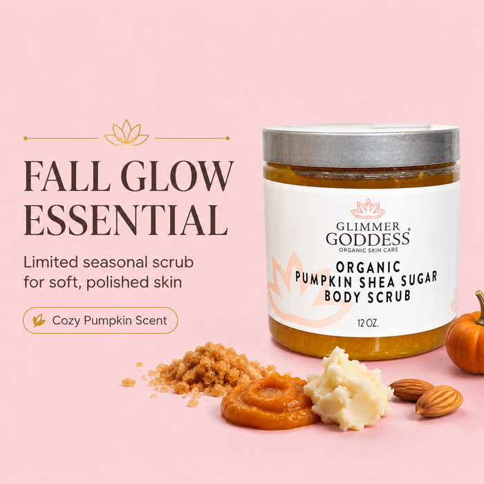 A jar of Glimmer Goddess Organic Pumpkin Shea Sugar Body Scrub on a soft pink background, styled with pumpkin pieces, almond, and scoops of the scrub with the text 'FALL GLOW ESSENTIAL'.