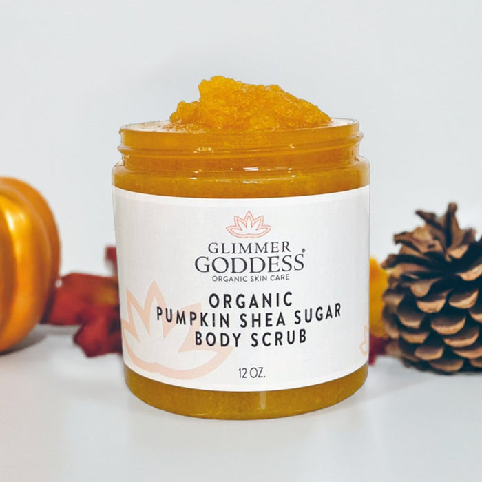 Organic pumpkin shea sugar body scrub in a jar with autumn decor