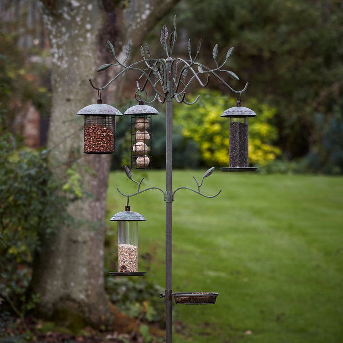 Peckish Secret Garden Dining Station in garden  with bird feeders