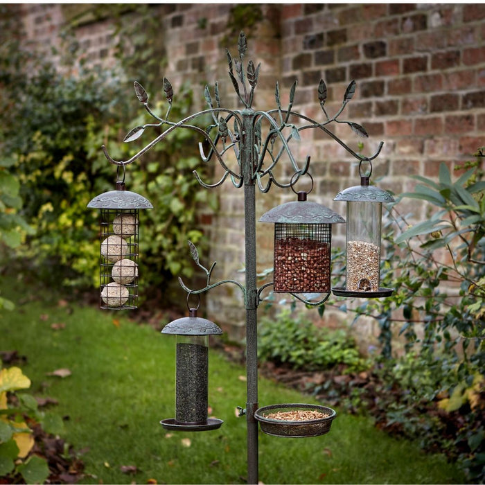 Peckish Secret Garden Dining Station in garden with bird feeders
