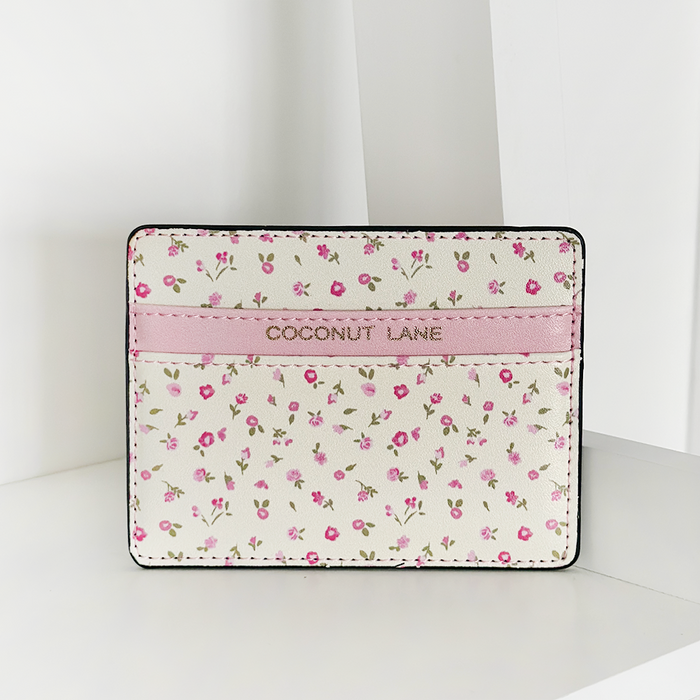 Pink card holder with a watercolour floral pattern by Coconut Lane.