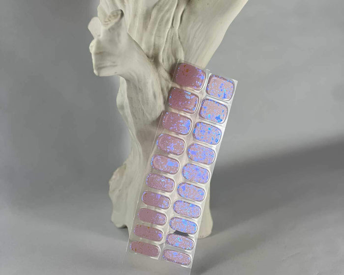 Pink Speckle gel nail wraps displayed on a nail tree