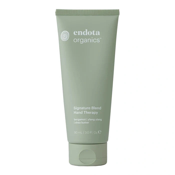 Green tube of endota organics hand therapy 90ml on a white background