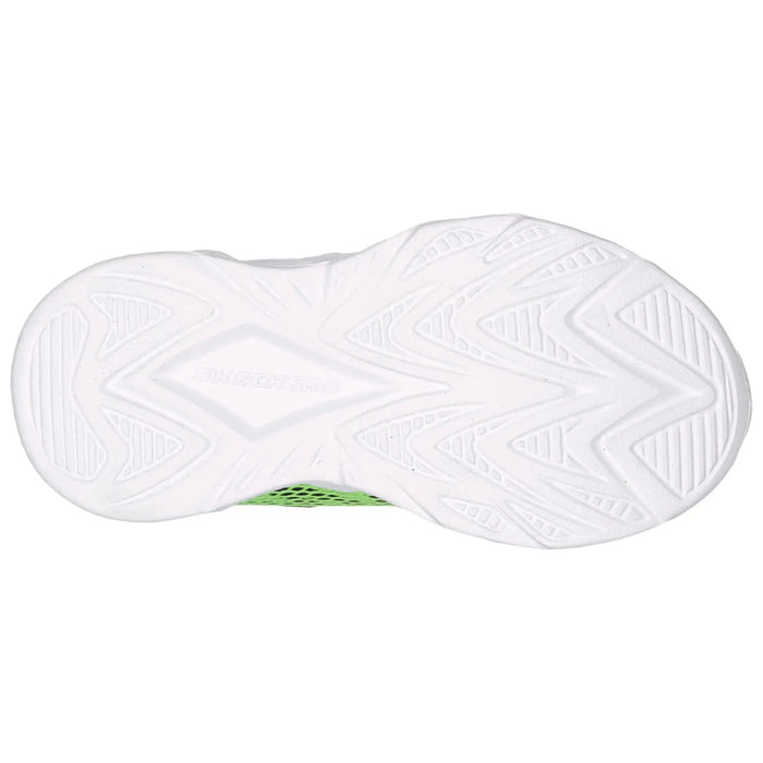 A white sneaker sole features a patterned tread design with grooves and ridges for traction placed on a flat surface showcasing its lightweight structure and design.