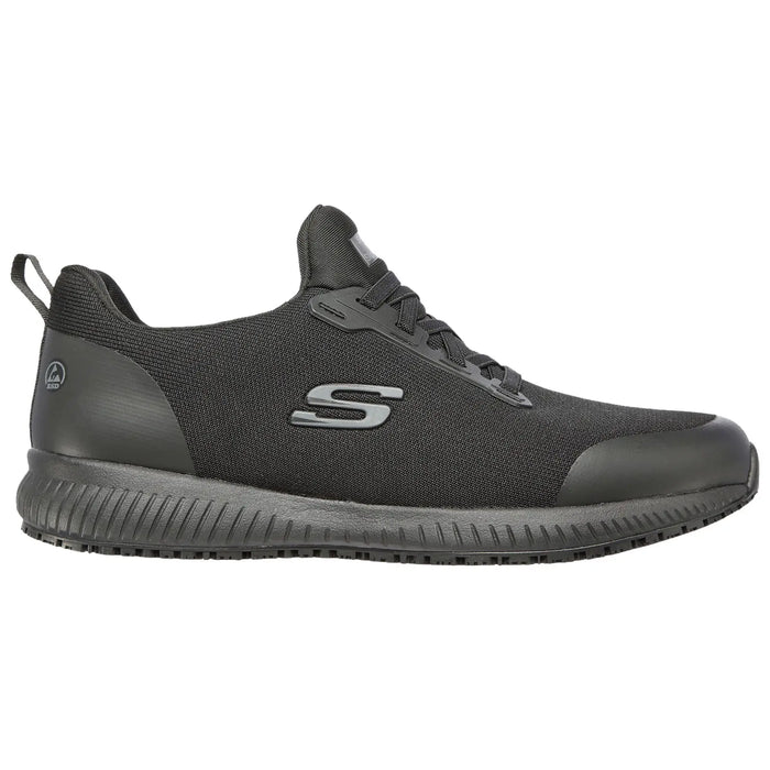 A black athletic shoe with a textured upper and a slightly raised sole is positioned sideways with laces tied showcasing a sleek and modern design suitable for sports or casual wear.