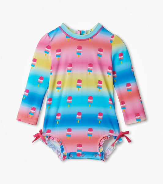 Hatley baby girl Sweet Treats rashguard swimsuit in Aqua/Pink with long sleeves and ruffle legs