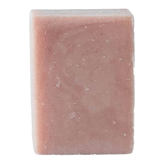 Rectangular patchouli rose bar of pink soap on a white background
