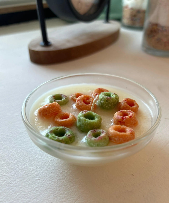 Apple Jack cereal-inspired candle in a glass bowl, resembling cereal in milk