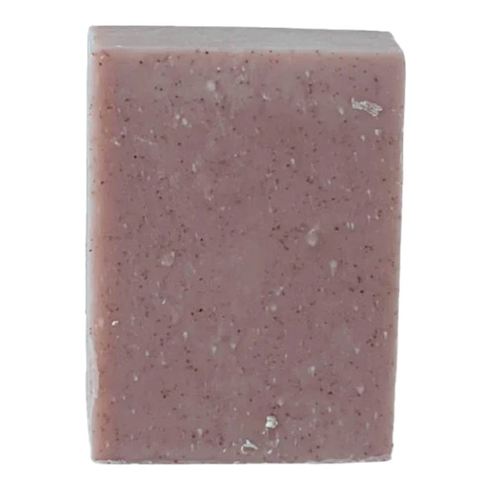 Purple lavender scrub, speckled soap bar on a white background