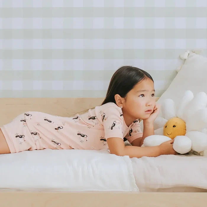 Toddler wearing toucan print summer pajama set Petit Lem