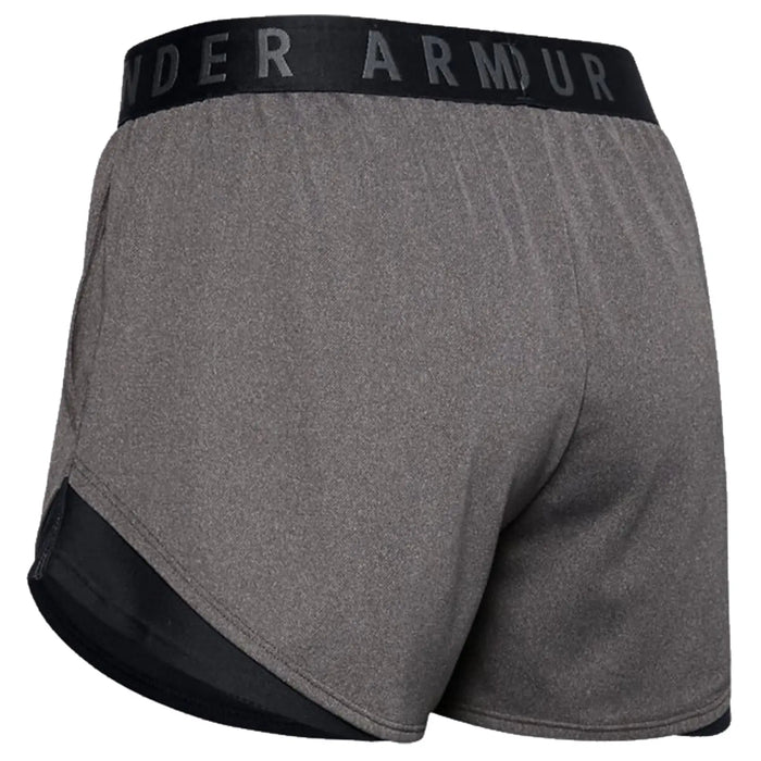 Gray athletic shorts are shown with a wide black waistband featuring the text UNDER ARMOUR The shorts have a mesh panel on the sides for breathability.