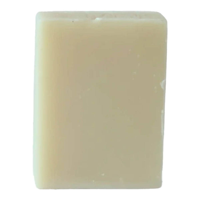 Rectangular bar of cinnamon, orange & patchouli soap on a white background